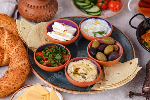 Preview: Traditional Turkish breakfast with meze and simit