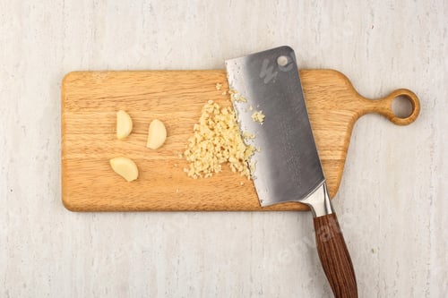 Preview: Home Cooking Chopped garlic on the Wooden Chopping Board