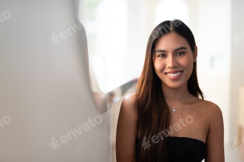 Preview: Young beautiful Asian woman smiling indoors