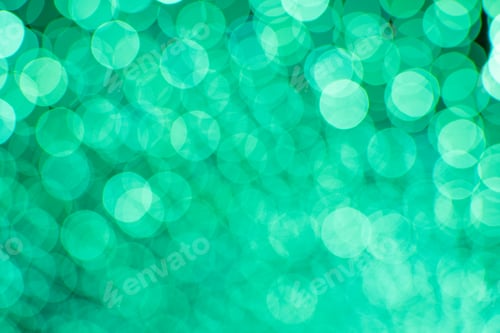 Preview: Emerald green abstract background of blue bokeh defocused blurred lights