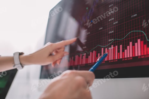Preview: Selective focus of data analysts pointing on graphs on computer monitor while testing security of