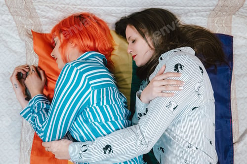 Preview: Two women laying on the bed smiling and sleeping