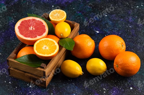 Preview: Top view of fresh fruits in wooden basket and ground