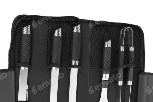 Preview: Set of tools for bbq in black bag. It is located on a white surface. Close-up.