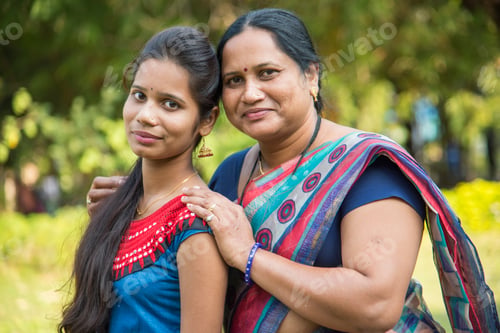 Preview: Portrait of happy mother and daughter embracing.