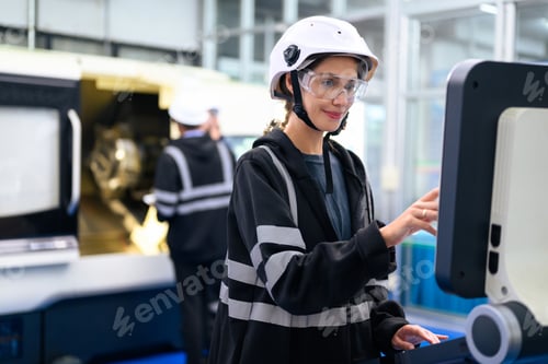 Preview: Engineer mechanician operating and controlling CNC machine