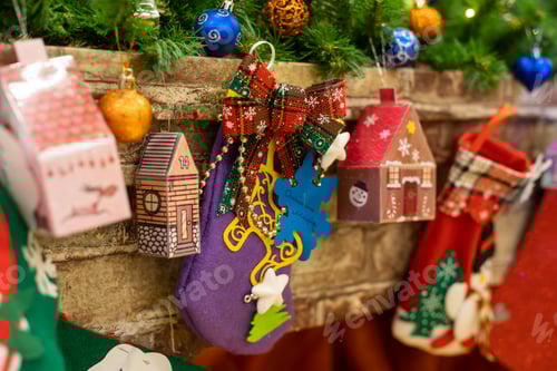 Preview: Christmas decoration stocking and toys hanging over rustic wooden background