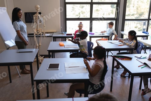 Preview: Schoolboy using virtual reality headset in classroom of elementary school