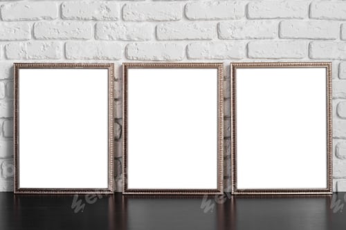 Preview: Blank picture frame against brick wall with copy space