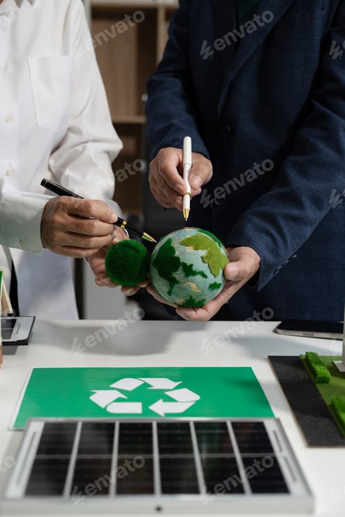Preview: Two colleagues discussing data sustainable development with renewable energy solutions