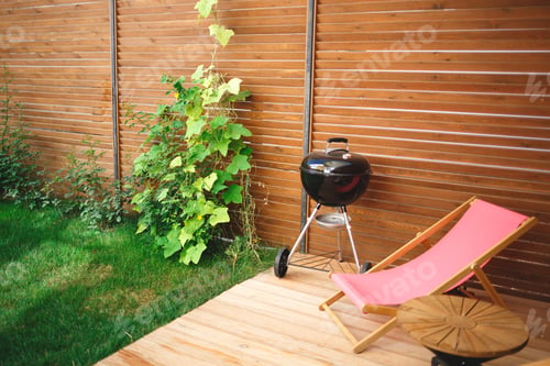Preview: resting place in the backyard. sun lounger, barbecue maker and table