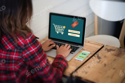 Preview: Woman sitting with laptop and typing in online shopping website.