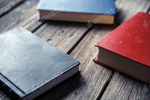 Preview: Top view on the pile of books lying on the table