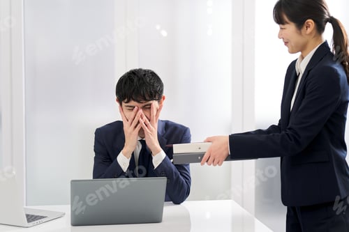Preview: Asian businessman overwhelmed by workload