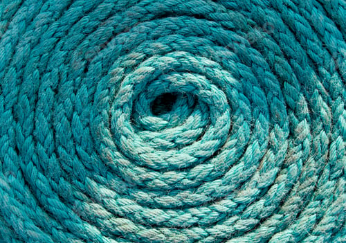 Preview: Heavy-duty light blue coiled ships rope looking from above. Round shapes for concept & copy space.
