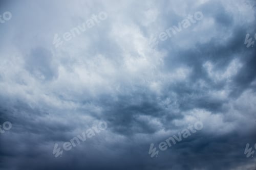Preview: dark stormy sky, dark clouds, dark sky with converging heavy clouds and violent storm before rain