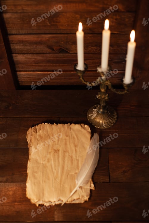 Preview: Halloween still life with burning candle on witch book and magic objects