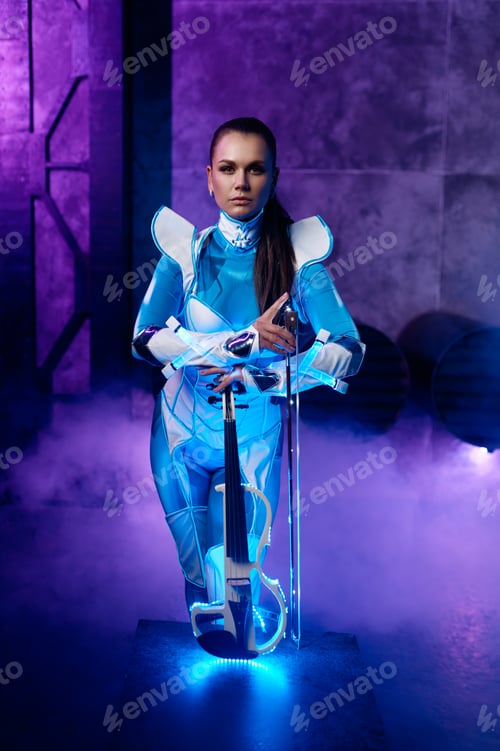 Preview: Young woman playing neon violin on blue smoke background