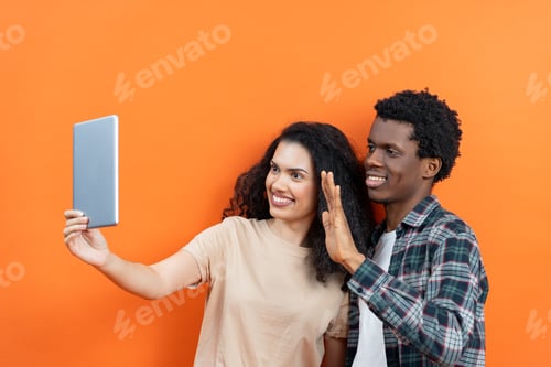 Preview: Happy Couple Engaged in Video Call Technology on Tablet