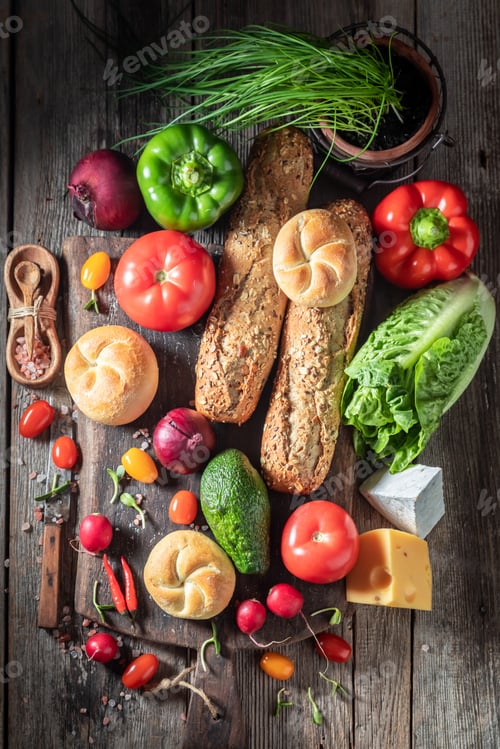 Preview: Tasty and fresh ingredients for sandwich on wooden table