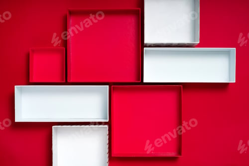 Preview: Open gift boxes on red background with copy space