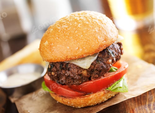 Preview: tasty gourmet burger with french fries in slanted composition