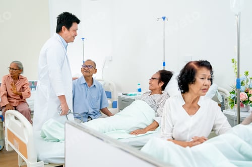 Preview: Asian doctor meet and talk with senior patient in common patient room and they look happiness