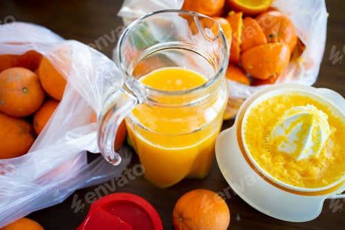 Preview: Summer fresh orange fruit getting squeezed