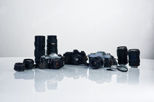 Preview: The professionals collection. Studio shot of various cameras and their accessories.
