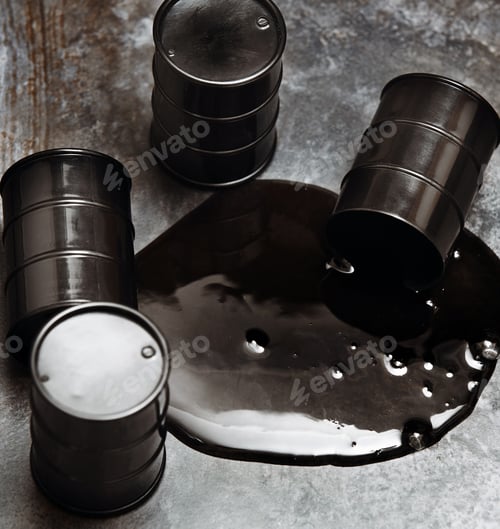 Preview: High angle view on four fuel drums with spilled oil