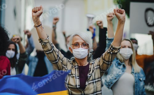 Preview: Crowd of activists protesting against Russian military invasion in Ukraine walking in street