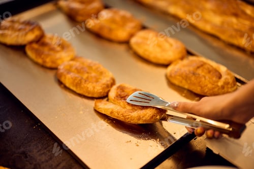 Preview: Close-up photo of a freshly baked pastry, at the bakery, focus on the cheesy pastry.
