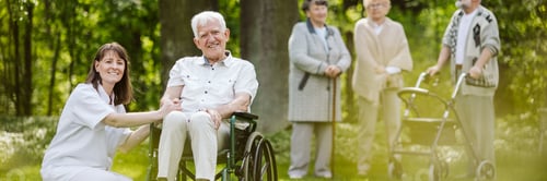 Preview: Mature caregiver and elder man on the wheelchair