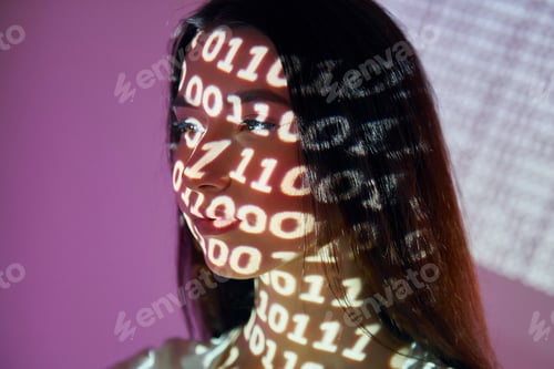 Preview: Binary machine code. Beautiful young woman is in projector neon lights in the studio
