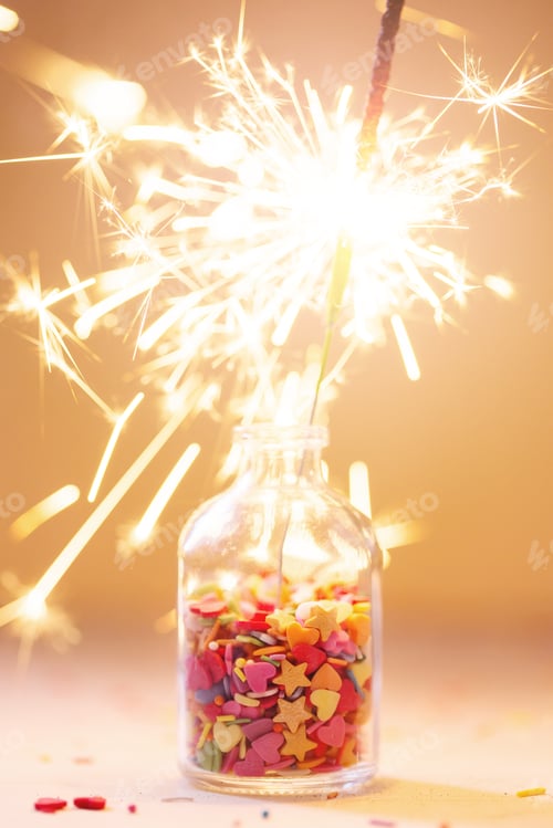 Preview: Burning sparkler in a bottle with colorful sprinkling, festive celebration party concept