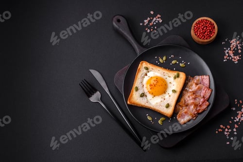 Preview: Heart shaped fried egg in bread toast with sesame seeds