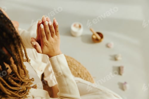Preview: Closeup of female hands during meditation.