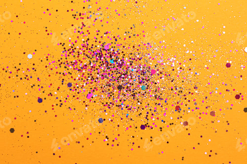 Preview: Shiny bright glitter on orange background, flat lay