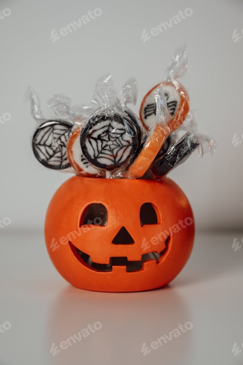 Preview: DArk, moody halloween banner with pumpking bowl with candies .vertical banner