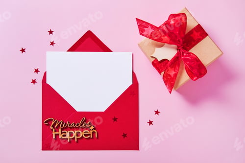 Preview: Greeting card mockup, white blank card in envelope and gift box on pink background.