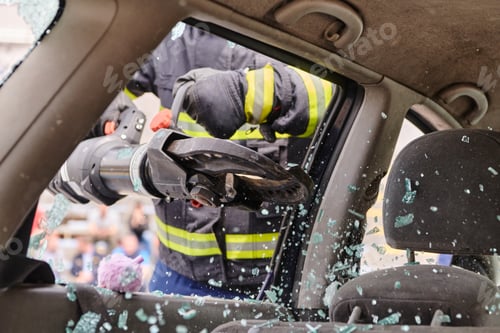 Preview: A dedicated team of professional firefighters employs specialized tools to cut and break through