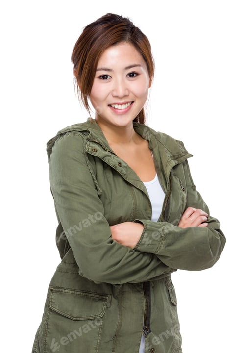 Smiling Woman in Green Jacket Posing on White