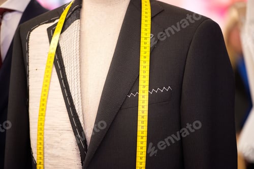 Preview: Pattern of a black almost finished jacket with a centimeter on it