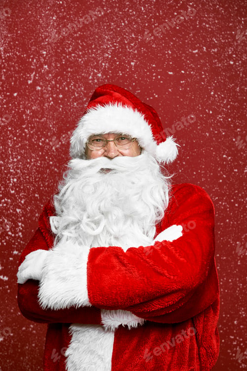 Preview: Caucasian Santa Claus on red background with snow