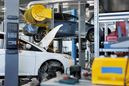 Preview: Auto repair shop. Cars open bonnet parked in garage for repair and maintenance service.