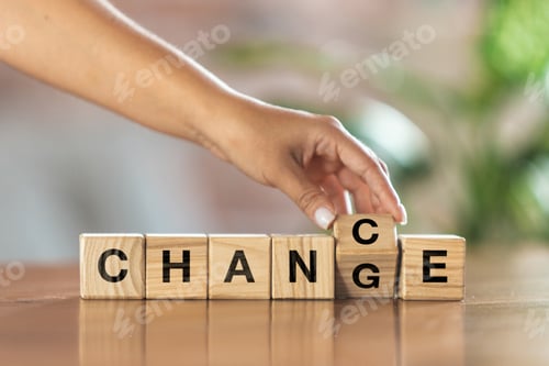 Preview: Wooden cubes, blocks with word Change in female hand. Conceptual image about human rights, education
