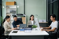 Preview: Group of Asian business meeting in planning design in creative business discussing work