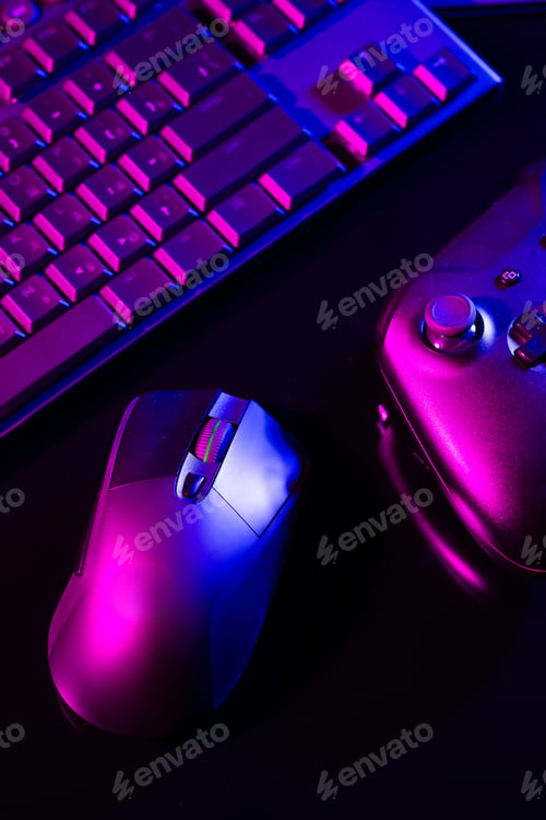Preview: Computer keyboard, mouse and joystick on black background