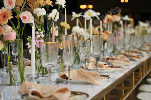 Preview: beautiful elegant decor of flowers and elegant serving on the wedding table.