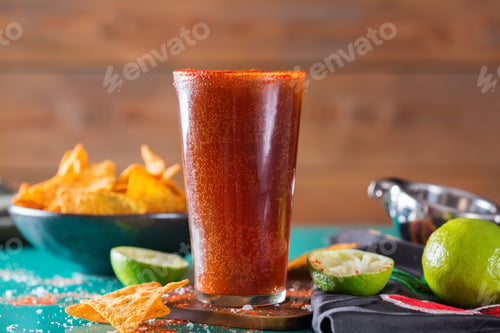 Preview: Mexican alcohol cocktail michelada with dark beer and lime juice